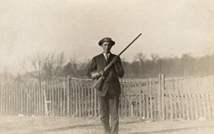 Images Dated 3rd July 2017: Man posing with rifle