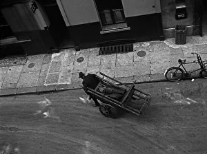 Overhead Prints: A man pulls a barrow in Marshall Street, London
