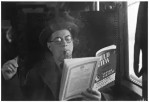 Man Reading on a Train