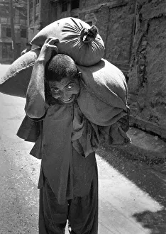 Laden Gallery: Man with sack, Kashmir