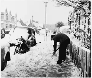 Man Shovels Snow