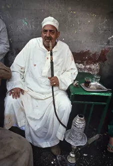 Images Dated 8th August 2019: A man sits in a back street tea shop in Cairo, Egypt