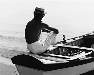 Studios Prints: Man Sitting in a Boat