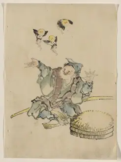 Layers Prints: A man, sitting on the ground, is wearing several layers of c