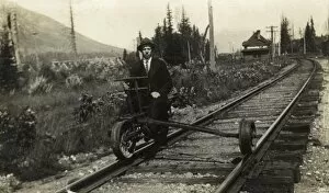 Images Dated 16th May 2012: A man sitting on part of a modified railway suspension