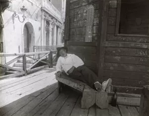 Venezia Gallery: Man sleeping on a bench in a side street, Venice, Italy