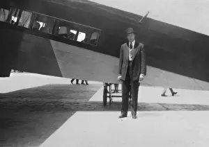 Trip Prints: Man standing in front of plane