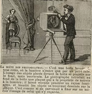 Man stands on chair to have portrait photographed