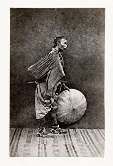 Man with sword and straw hat, Japan