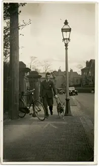 Alsatian Prints: Man taking an Alsatian dog for a walk