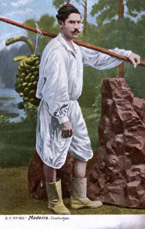 New images august 2021, man traditional costume carrying bananas