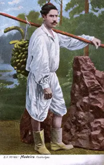Man in traditional costume, carrying bananas, Madeira