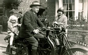 Locks Collection: Man on veteran motorcycle with young girl