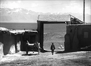 Xinjiang Prints: Man in a walled settlement, Kashgar, western China