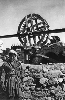 Man in front of a well, Beersheba, Holy Land