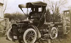 Images Dated 7th July 2016: Man at the wheel of an early car, USA