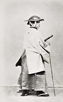 Man in winter costume with sword, Japan
