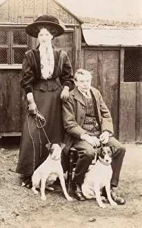 Pinstripe Prints: Man and woman with two Jack Russell terriers