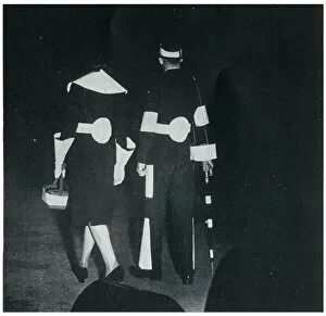 Man and woman in reflective clothing, September 1939