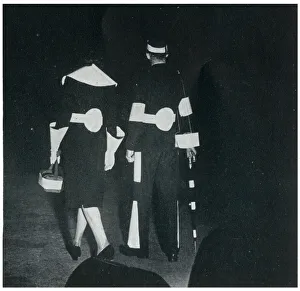 Visibility Gallery: Man and woman in reflective clothing, September 1939