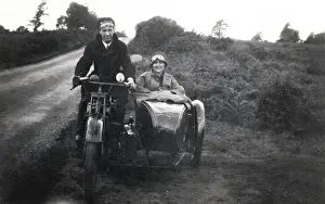 Man & woman on veteran motorcycle combination
