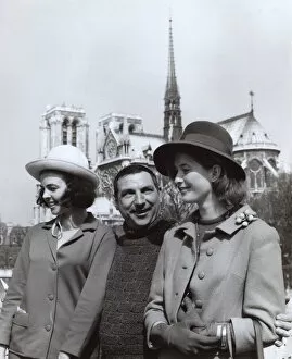 Man and two women near Notre Dame, Paris, France