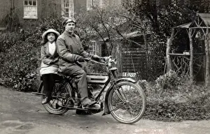 Triumph Prints: Man & young girl on a 1911 Triumph motorcycle