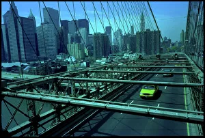 Manhattan Prints: Manhattan skyline from Brooklyn Bridge with yellow cab, USA