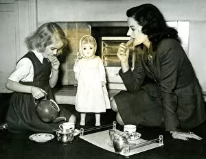 Pouring Collection: Margaret Lockwood at tea party with daughter Julia