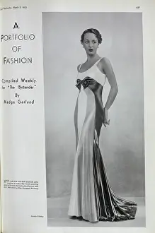 Margaret Rawlings, actress, (1906-1996) fashion studio portrait. With description, White, pale blue and dark blue cire satin combine to make this lovely evening gown by Norman Hartnell