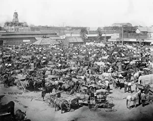 Market Square, Cleburne, Texas. Photograph shows Market Square in Cleburne, Texas looking northeast; with people, horses, and wagons in foreground, . Date 1850-1900 Market Square, Cleburne, Texas