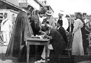 Examining Prints: Martial law in Egypt: Examining passports at Port Said since Turkey formally declared war