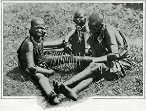 Coil Collection: Masai young women adjusting iron wire