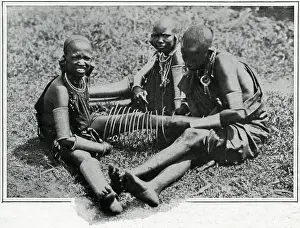 Plugs Prints: Masai young women adjusting iron wire