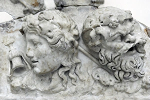 Masks of Dionysos and Silenos. Roman relief. 2nd century AD