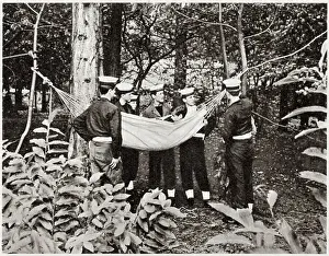 Cadets Prints: Members of the Naval section of Wellington College's cadet force learning how to sling a hammock in contrasting