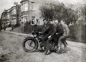 Four men on a 1923 Rudge motorcycle