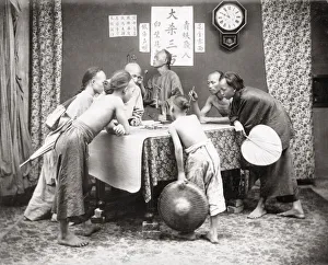 Weighing Prints: Men and boys with weighing scales, China c. 1890