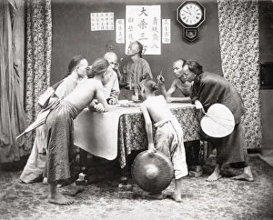 Men and boys with weighing scales, China c.1890