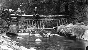 Suitable Prints: Two men on a bridge at Tilberthwaite in the Lake District