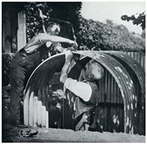 Images Dated 12th July 2019: Two men building an Anderson shelter, September 1939