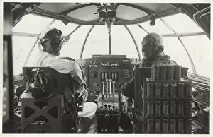 Goggles Collection: Two men at the controls of a Sunderland flying boat