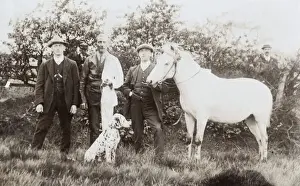 Dalmatians Prints: Three men with dalmatian and pony