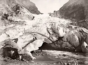 Two men on the face of a glacier, likely Switzerland
