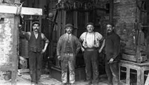 Four men in hat factory finishing room