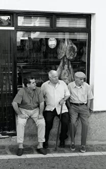 Images Dated 13th June 2016: Three men outside shop, Spain