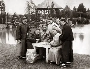 Men playing a board game, China, circa 1880s