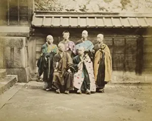 Shaved Prints: Six men, possibly monks, posed for group portrait, four stan
