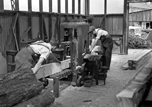 Processing Prints: Two men sawing wood