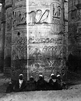 Pillar Collection: Men sitting at base of column, Karnak, Egypt